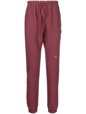 Advisory Board Crystals pantalon de jogging à patch logo - Rouge