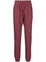 Advisory Board Crystals pantalon de jogging à patch logo - Rouge