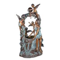 A BRONZE LADY SITTING ON A POND WITH FOUR PUTTI