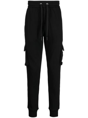 Moose Knuckles pantalon de jogging en coton à poches cargo - Noir
