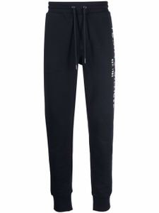 Tommy Hilfiger pantalon de jogging à logo brodé - Bleu