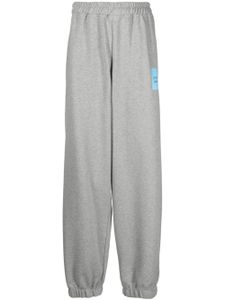 VETEMENTS pantalon de jogging ample à logo imprimé - Gris