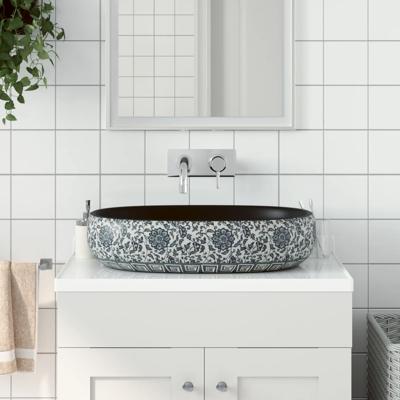 VidaXL Opzetwasbak ovaal 59x40x14 cm keramiek zwart en blauw
