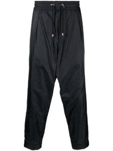 Balmain pantalon fuselé à motif monogrammé - Noir