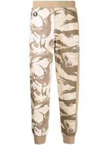 AAPE BY *A BATHING APE® pantalon de jogging à imprimé camouflage - Vert