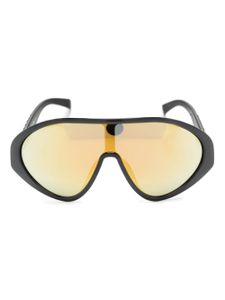 Moschino Eyewear lunettes de soleil oversize à logo gravé - Noir