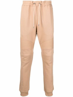 Balmain pantalon de jogging à logo imprimé - Tons neutres