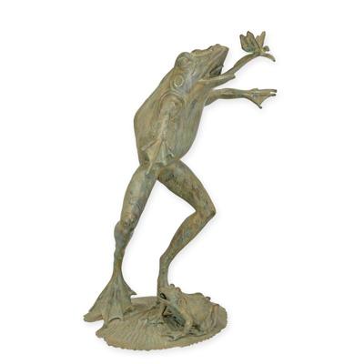 A BRONZE FOUNTAIN FROG WITH DRAGONFLY