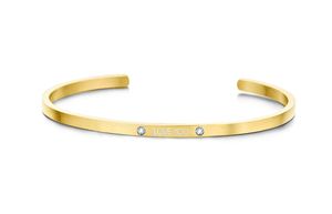 Key Moments 8KM-B00466 Stalen open bangle met tekst * love you* zirkonia one-size goudkleurig