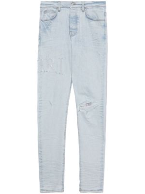 AMIRI jean skinny à ornements en cristal - Bleu