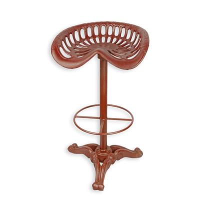 A CAST IRON BAR STOOL, RED