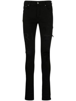 AMIRI jean skinny à logo imprimé - Noir