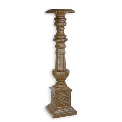 A CAST IRON CANDLE STAND - BROWN
