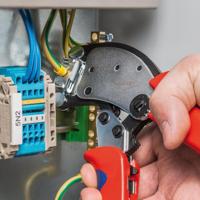 KNIPEX twistor 16 zelfinstellende krimptang voor adereindhulzen (rood/blauw, met draaibare krimpkop)