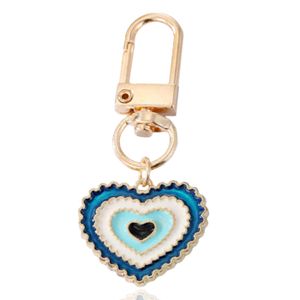 Goudkleurige Hart Sleutelhanger Blauw met Musketonhaak