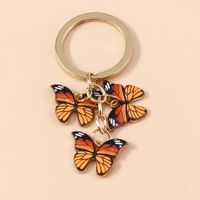 Oranje vlinder sleutelhanger - Sleutelhangers - Spiritueelboek.nl