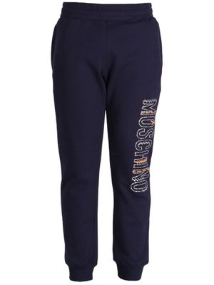 Moschino pantalon de jogging en coton à logo imprimé - Bleu