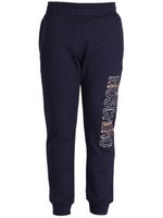 Moschino pantalon de jogging en coton à logo imprimé - Bleu