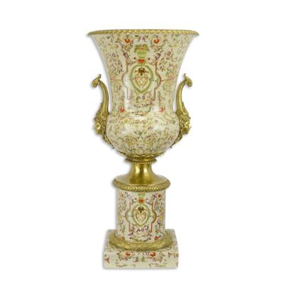 A BRONZE MOUNTED URN ON BASE