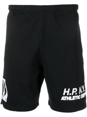 Heron Preston short de sport en coton à slogan imprimé - Noir