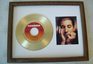 Gouden plaat Single Paul Simon Loves Me Like A Rock