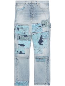 AMIRI jean taille haute à détails de patchwork - Bleu