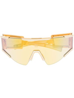 Balmain Eyewear lunettes de soleil à monture transparente - Or