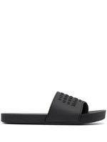 Maison Margiela claquettes Tabi à logo embossé - Noir