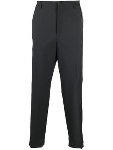 Valentino Garavani pantalon de costume ample à rayures latérales - Gris