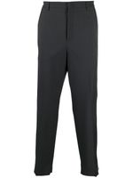 Valentino Garavani pantalon de costume ample à rayures latérales - Gris