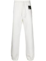 OAMC pantalon de jogging en coton à patch logo - Blanc