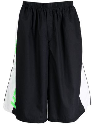 Haider Ackermann short de sport en coton à logo imprimé - Noir