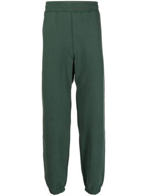 Suicoke pantalon de jogging à logo imprimé - Vert