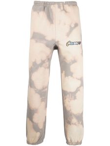 Pleasures pantalon de jogging à imprimé tie dye - Gris