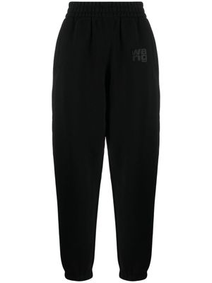 Alexander Wang pantalon de jogging fuselé à logo imprimé - Noir