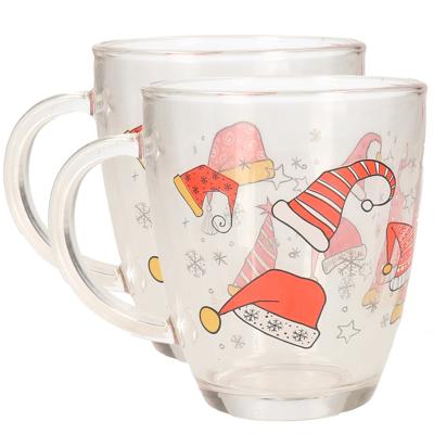 Kerst mok/beker - 2x stuks - met kerstmutsen - glas - 300 ml - kerstbekers - kerstartikelen
