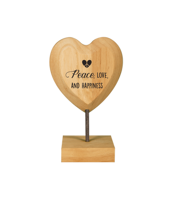 Houten hart op voet peace, love and happiness