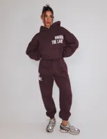 Unique The Label Elyana Trainingspak Dames Donkerbruin - Maat S - Kleur: Donkerbruin | Soccerfanshop