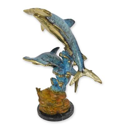 A BRONZE SCULPTURE OF A PAIR OF HAMMERHEAD SHARKS