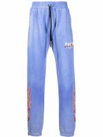 AMIRI pantalon de jogging à flammes brodées - Bleu