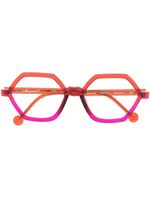 L.A. EYEWORKS lunettes de vue géométriques à design transparent - Rouge