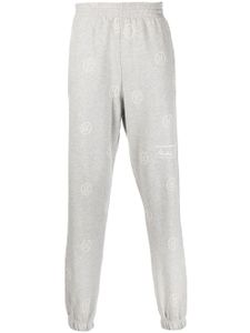 Martine Rose pantalon de jogging à motif monogrammé - Gris