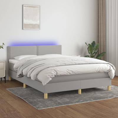 Boxspring met matras en LED stof lichtgrijs 140x190 cm