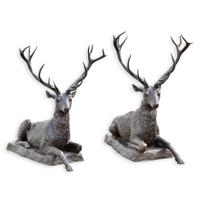 A BRONZE PAIR OF RECLINING DEER