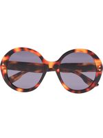 Gucci Eyewear lunettes de soleil à effet écaille de tortue - Marron