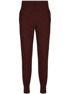 Dolce & Gabbana pantalon de jogging en soie à motif en jacquard - Rouge