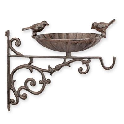 A CAST IRON WALL MOUNT BIRD BATH WITH HOOK