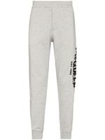 Alexander McQueen pantalon de jogging à imprimé graffiti - Gris