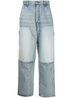AMBUSH jean évasé à design à empiècements - Bleu