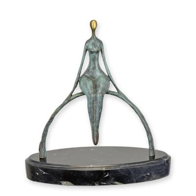 A BRONZE SCULPTURE OF A MODERN MAN SITTING ON A BOW